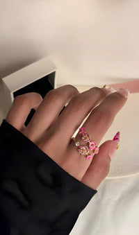 Delicato anello floreale con zirconi rosa e bianchi